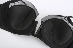 Detail of black V-neck bra showing smooth inner lining and fine mesh edge construction