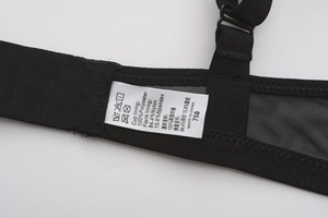Detail view of black mesh bra showing 75B size tag and premium fabric composition label