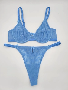 Detail of light blue lace bra set with delicate rose floral embroidery and bows