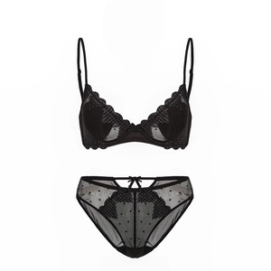 Detailed view of black lace lingerie set with heart mesh embroidery and bow detail