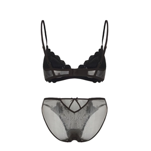 Detailed back view of black lace lingerie set with mesh details and bow accents