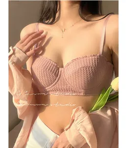Close-up of pink waffle texture fabric and delicate straps on a French style bra
