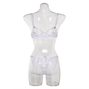 Detailed embroidery on white lace lingerie set with mesh fabric on mannequin