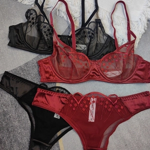 Lace lingerie set featuring sheer floral embroidery and polka dot mesh in black and wine red