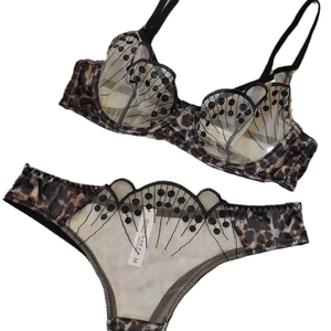 French leopard print lace lingerie set with sheer mesh and butterfly embroidery detail