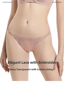 Detail of floral embroidery and thin side straps on sexy dusty rose lace panties