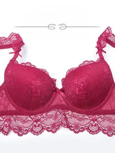 Close-up of deep red lace bra detailing floral embroidery and delicate bow accents