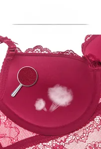 Detail of red lace bra interior showing breathable fabric with steam effect