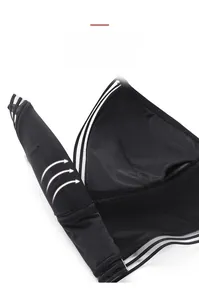 Close-up of flexible black wireless bra showing soft fabric and elastic striped edges