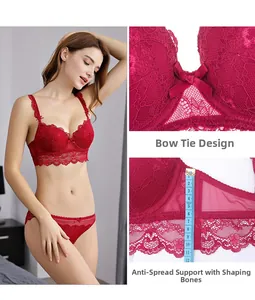 Detail of red lace bra featuring side bone support for breast shaping and bow center