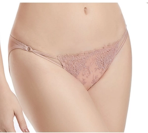 Close-up of pink floral lace embroidery and thin elastic straps on women underwear