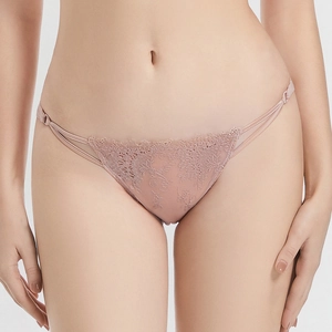 Elegant dusty pink lace panties with floral embroidery and double side straps on model