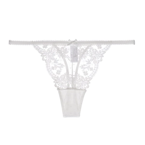 Macro shot of white eyelash lace thong detailing floral embroidery and a small ribbon bow