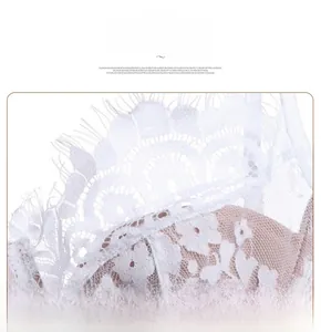 Close-up of white eyelash lace embroidery and mesh texture on French style bra