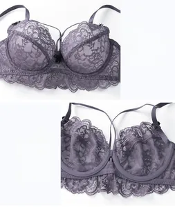 Detail of purple floral lace bra featuring breathable mesh lining and a black bow accent