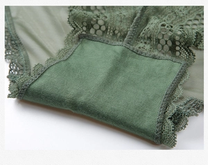Detail showing the breathable cotton crotch and lace texture of dark green panties