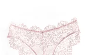 Close-up of pink lace panties showing breathable floral pattern and delicate eyelash trim