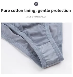 Vue macro détaillée de la dentelle en maille et de l'entrejambe en coton de la culotte grise