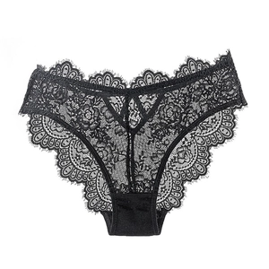 Detailed close-up of floral eyelash lace fabric on black sheer women's panties