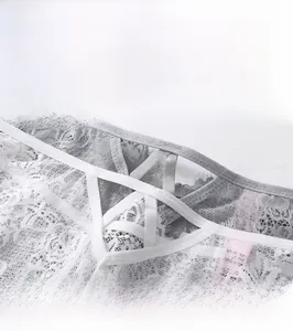 Close-up of lace panties featuring white cross-strap hollow-out design on the back