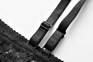 Close-up of adjustable double straps and floral lace detail on a black bra set