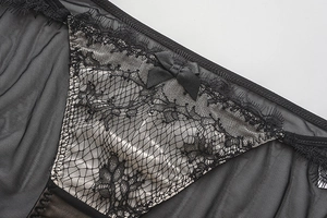Detailed view of black French eyelash lace panties with delicate bow and floral embroidery
