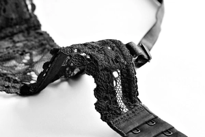 Close-up of elegant black floral lace bra detail with adjustable straps and back hook closure