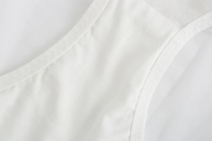 Macro shot of fine stitching and soft white cotton fabric on breathable lace underwear