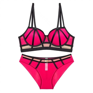 Fuchsia lace lingerie set with contrast black straps and gold logo pendants