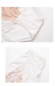 Close-up of white floral lace embroidery and soft cotton crotch on women's low-waist panties