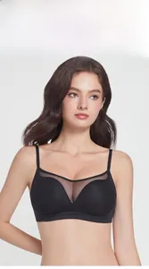 Close-up of black seamless mesh bralette with translucent lace detail and thin straps
