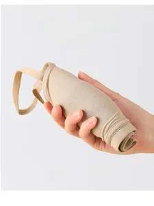 Detail of flexible nude wire-free bra being rolled 360 degrees to show soft elasticity