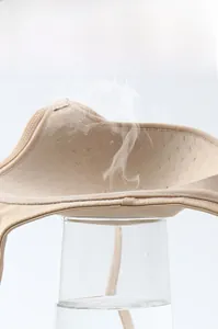 Detail of breathable inner padding showing steam passing through mesh vent holes