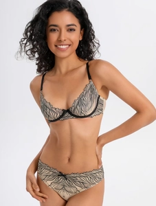 Detailed view of beige lace lingerie set with elegant black embroidery and sheer mesh texture