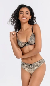 Detail of floral black embroidery on a beige lace bra and matching panty set