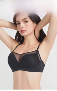 Detail view of the wide side wings on seamless black lace mesh bralette for extra support