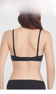 Detail view of seamless black lingerie bra back with adjustable straps and hook-and-eye closure