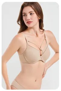 Detail of nude soft wire bra with mesh splicing and cross strap design for support