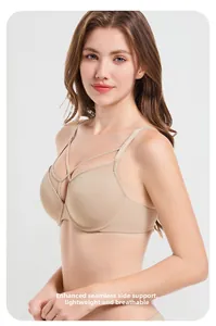 Detail of seamless skin-tone bra featuring crossover straps and high side ratio design