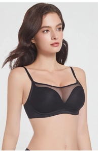 Detail of French style seamless black bra with mesh patchwork and thin straps