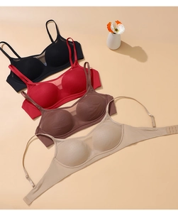 Flat lay of seamless wire-free bras in black, red, coffee, and beige mesh fabric