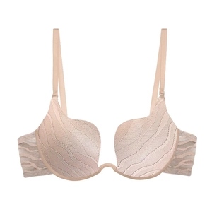 Close-up of beige deep V U-shaped bra featuring wavy texture and mesh side wings