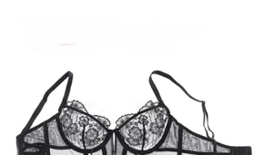 Detail of vintage black lace corset with fishbone support and floral embroidery patterns