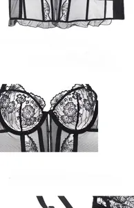 Detail of black lace corset bra featuring floral embroidery and soft underwire support