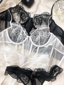Detailed view of floral lace embroidery and boning structure on elegant lingerie sets