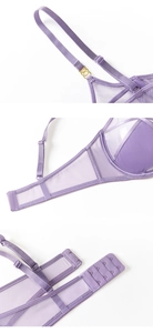 Detail of lavender mesh bra with adjustable straps and gold rings on white background