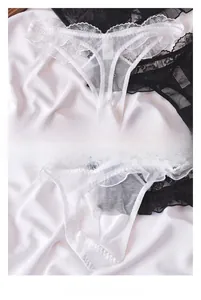 Detail view of sheer lace thongs with scalloped edges and breathable cotton lining