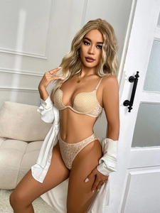 Close-up of deep V-neck mesh bra and leopard print panties set in beige color