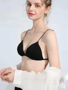 Detailed view of seamless black triangle bralette with thin straps for women
