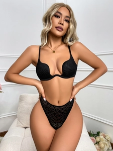 Front view of black deep U-plunge push-up bra and leopard mesh high-cut thong lingerie set
